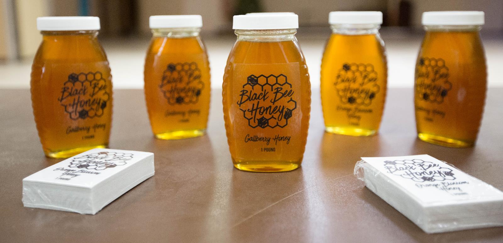 selection of raw local honey in bottles
